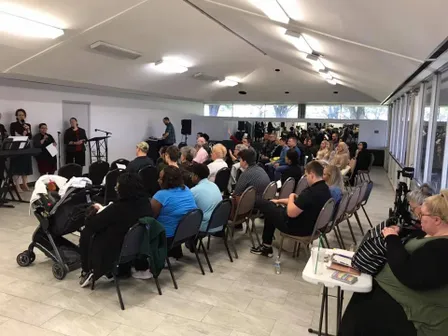 The Home Church congregation worshipping together